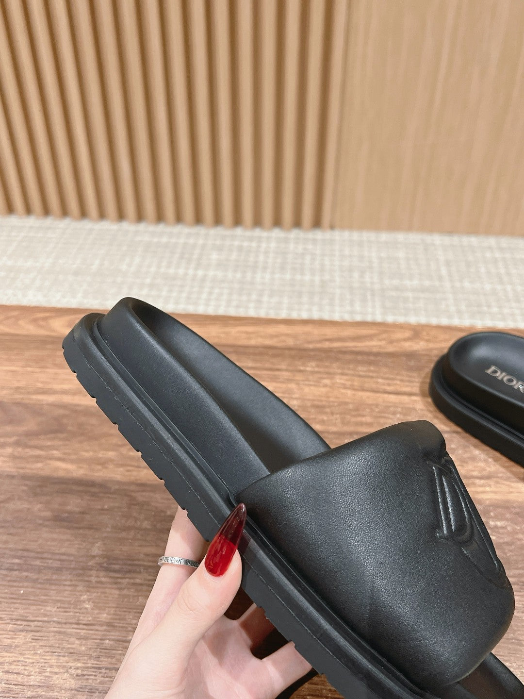 Black Dior unisex slide sandal with thick rubber sole and textured strap