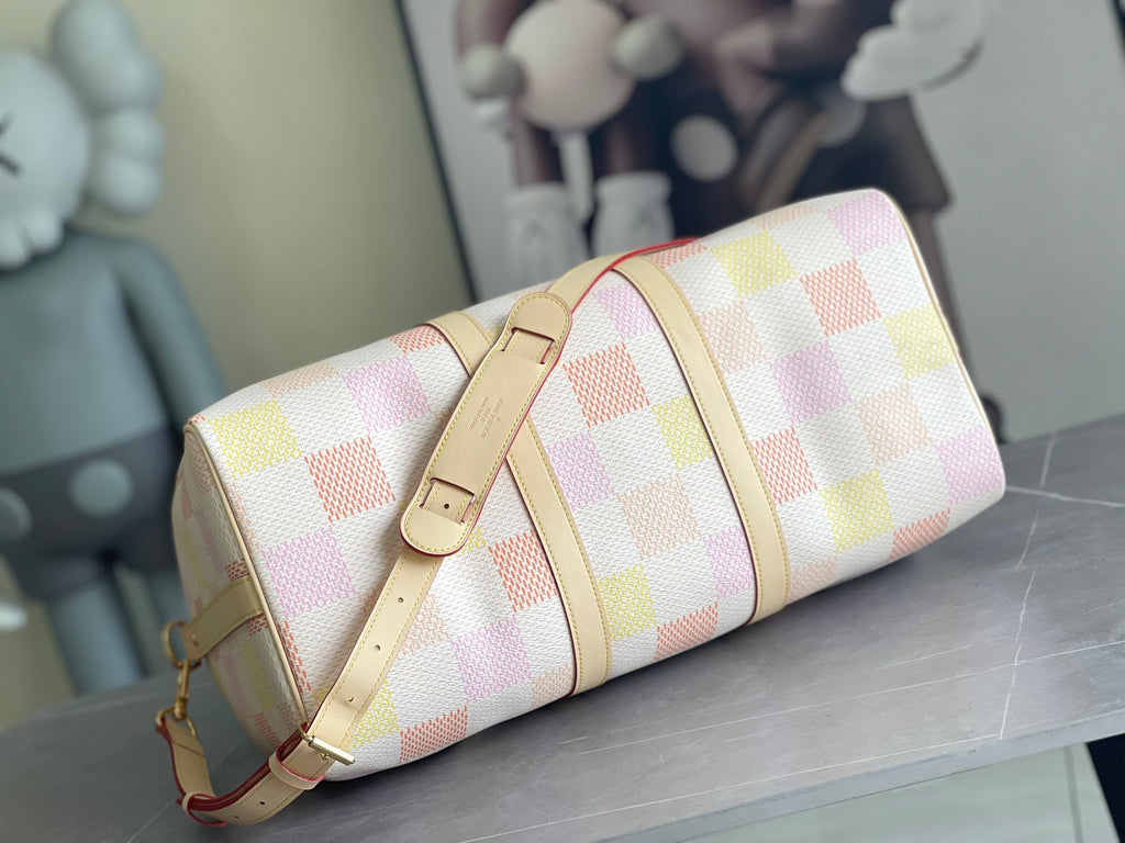 Louis Vuitton bag with multicolor check canvas, side strap, and gold-tone hardware