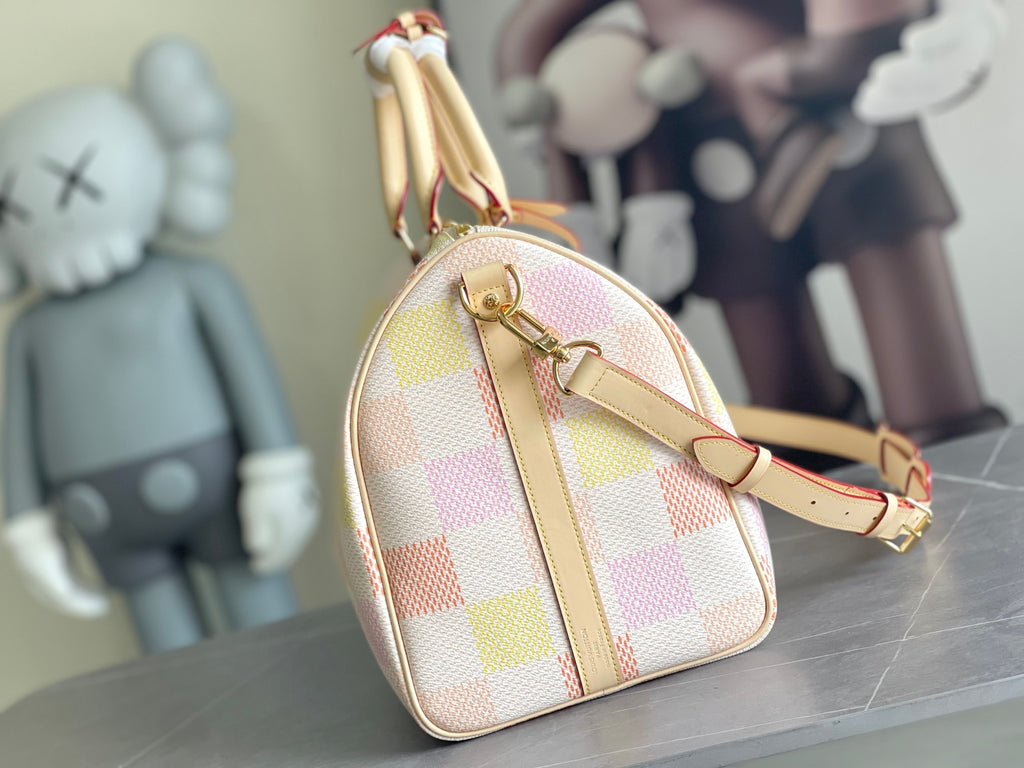 Louis Vuitton bag with rounded top handle, shoulder strap, and multicolor check canvas