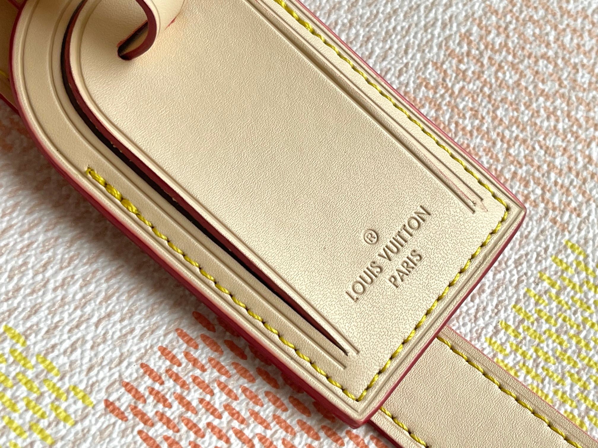 Louis Vuitton Paris leather patch with gold lettering and contrast edge stitching