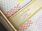 Louis Vuitton logo leather patch on cream lining with gold text and yellow stitching
