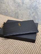 YSL quilted leather clutch with chevron quilting and gold-tone YSL emblem