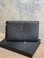 YSL quilted leather clutch with chevron stitching and gold-tone YSL logo