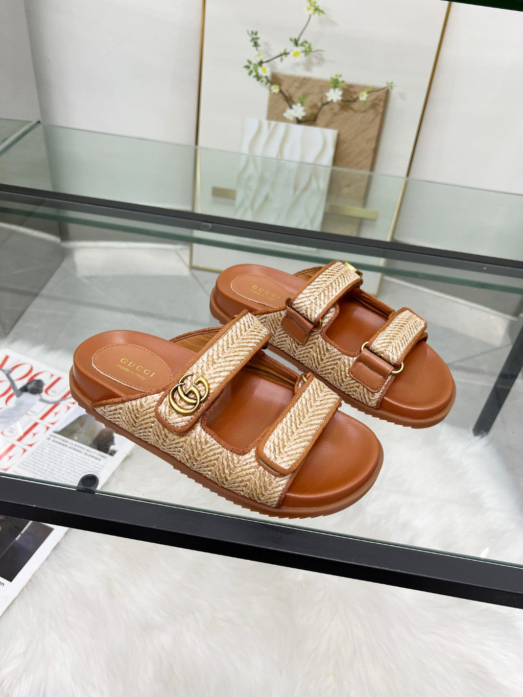 Gucci luxury slide sandals in tan with textured double straps and gold buckle detail