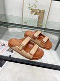Gucci luxury slide sandals in tan with textured double straps and gold buckle detail