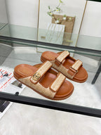 Gucci luxury slide sandals in tan with textured double straps and gold buckle detail