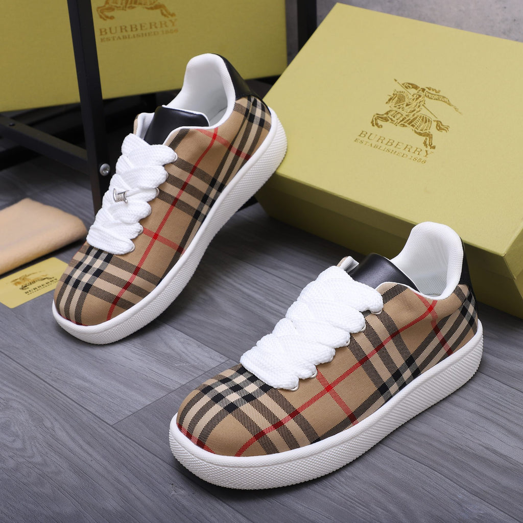 Burberry low-top sneakers in tan, black, and red plaid with white laces