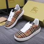 Burberry low-top sneakers in tan, black, and red plaid with white laces