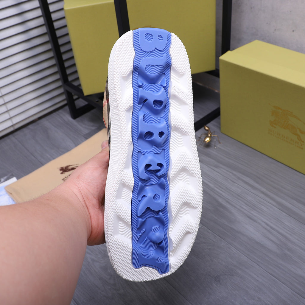 Burberry sneaker outsole with blue traction pattern on white rubber sole