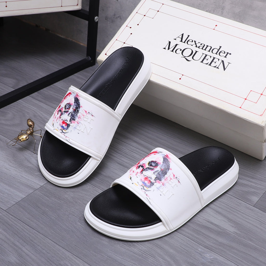 Alexander McQueen slide sandals, pair view; white uppers with red/blue skull artwork