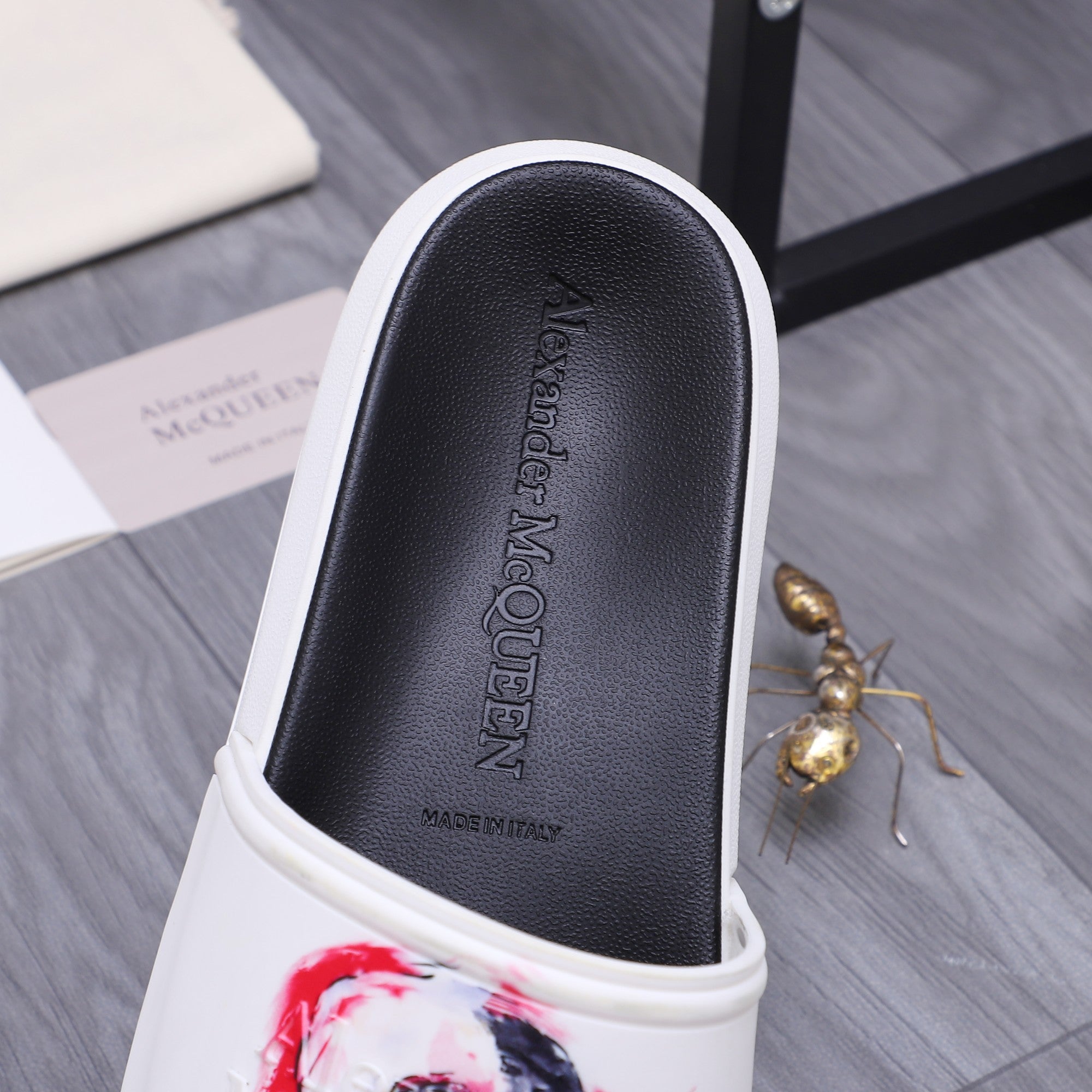 Alexander McQueen slide sandal footbed with embossed logo, black leather-style