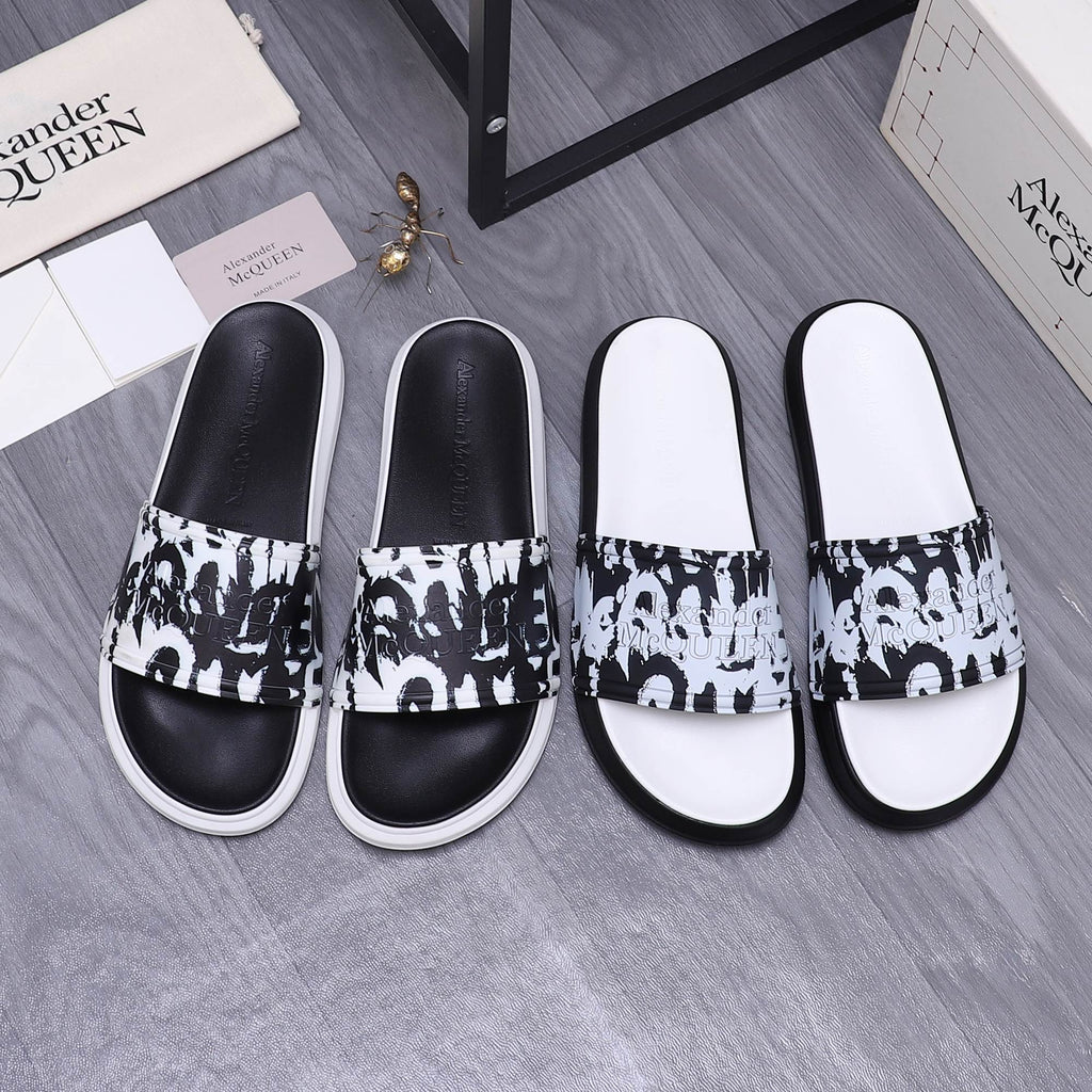 Alexander McQueen slide sandals with black and white graphic strap and white rubber sole