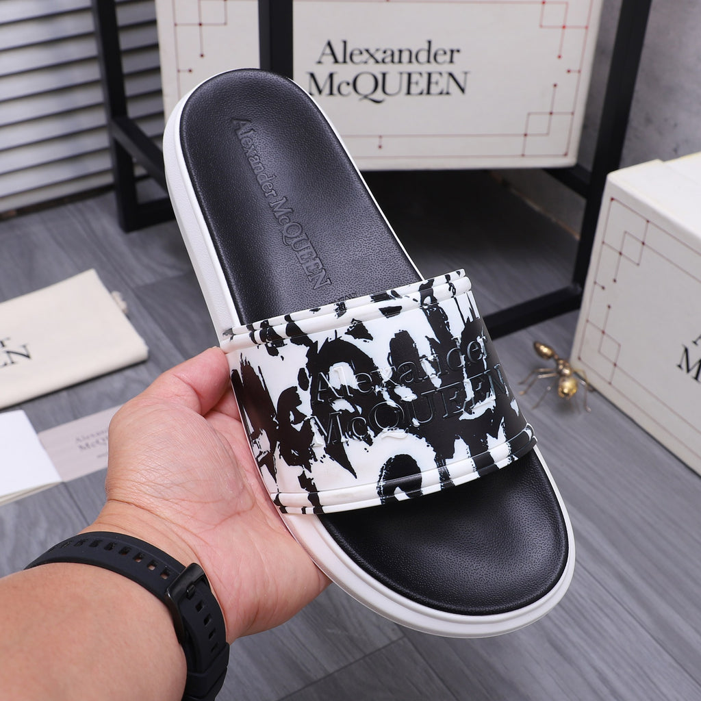 Alexander McQueen slide sandals, black sole with black-and-white graphic strap