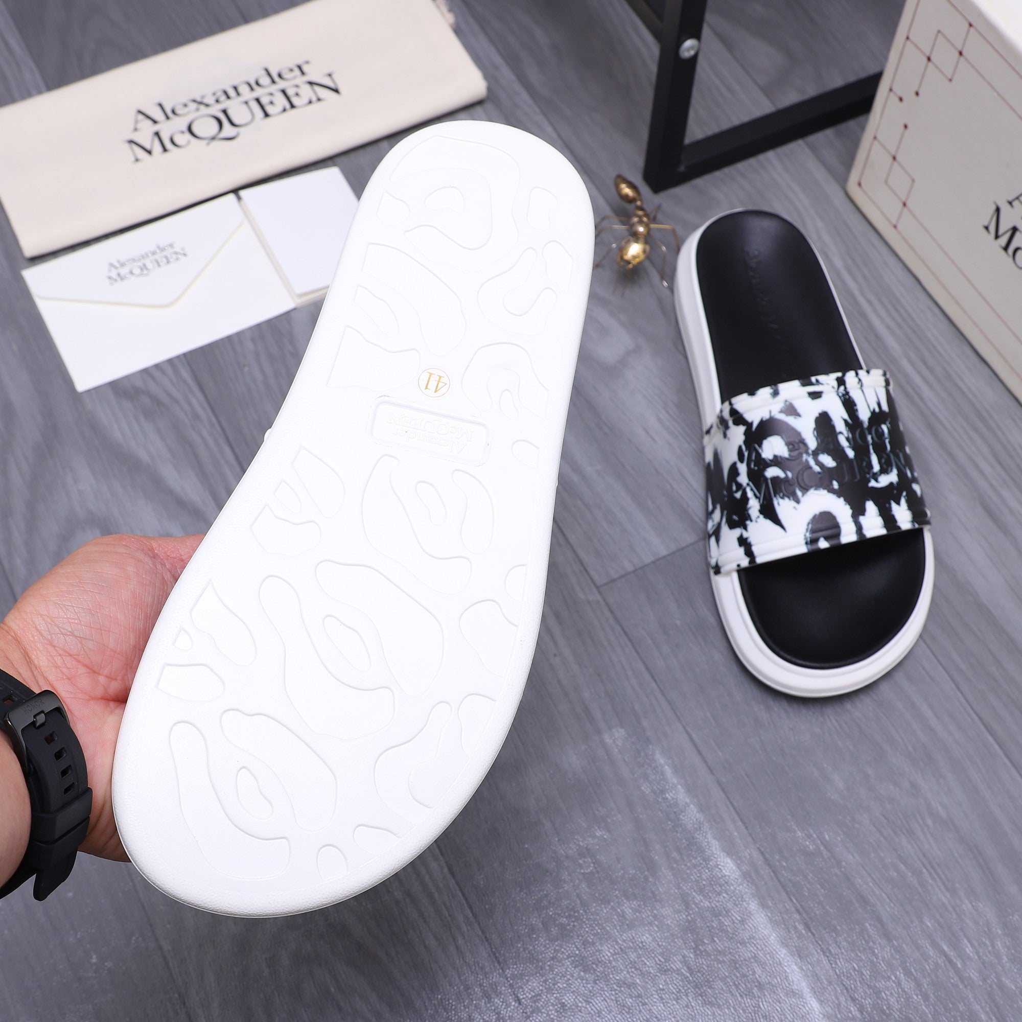 Alexander McQueen slide sandal outsole in white, with matching black-and-white graphic upper
