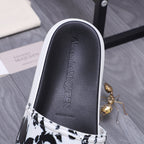 Alexander McQueen slide sandal insole, black leather with embossed brand lettering