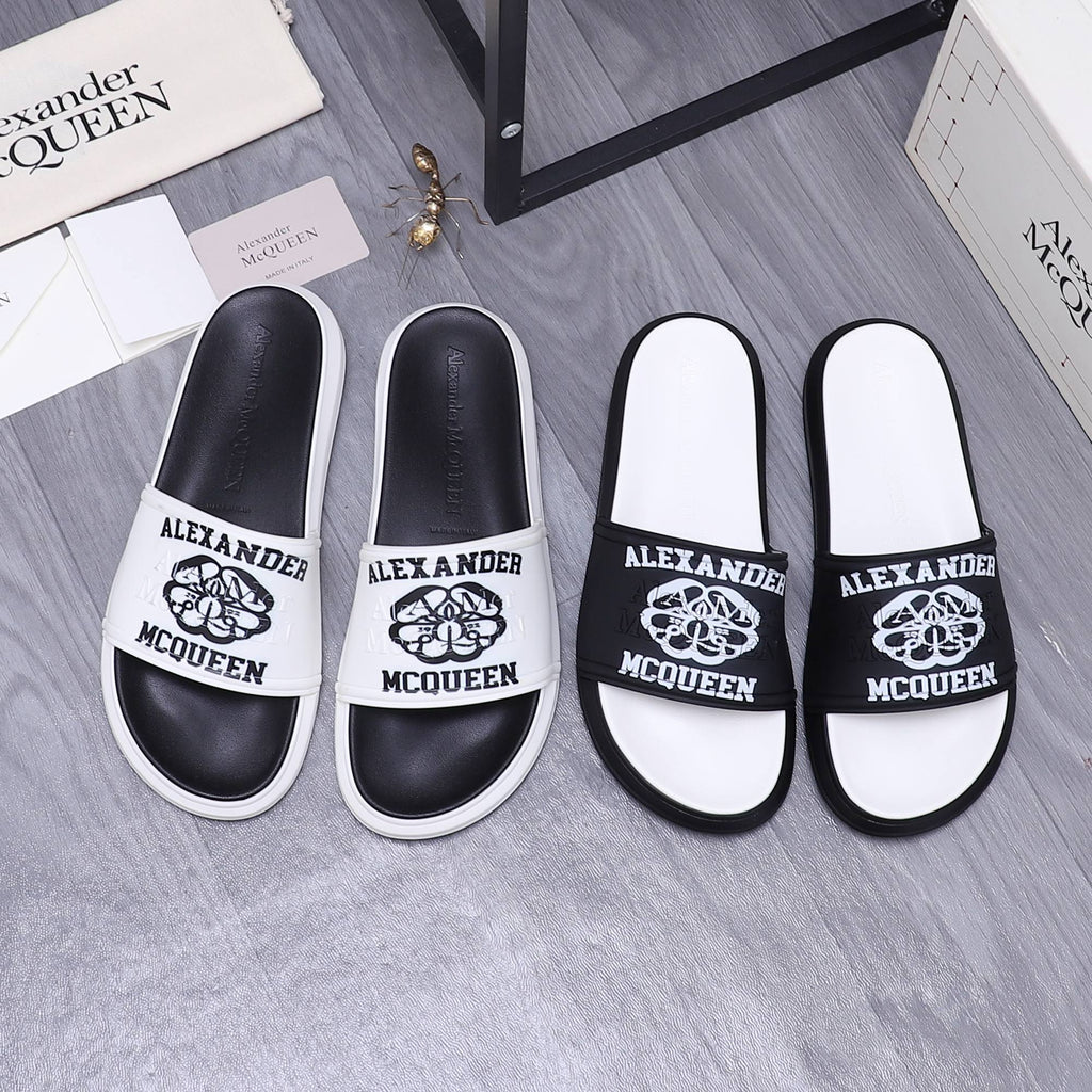 Alexander McQueen slide sandals, black straps with logo print and white footbed
