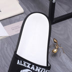 Alexander McQueen slide sandal, white footbed with black strap and sidewall detail