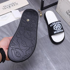 Alexander McQueen slide sandal outsole, dark textured rubber tread