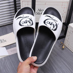 Alexander McQueen slide sandals, white upper with black insole and graffiti-style graphic
