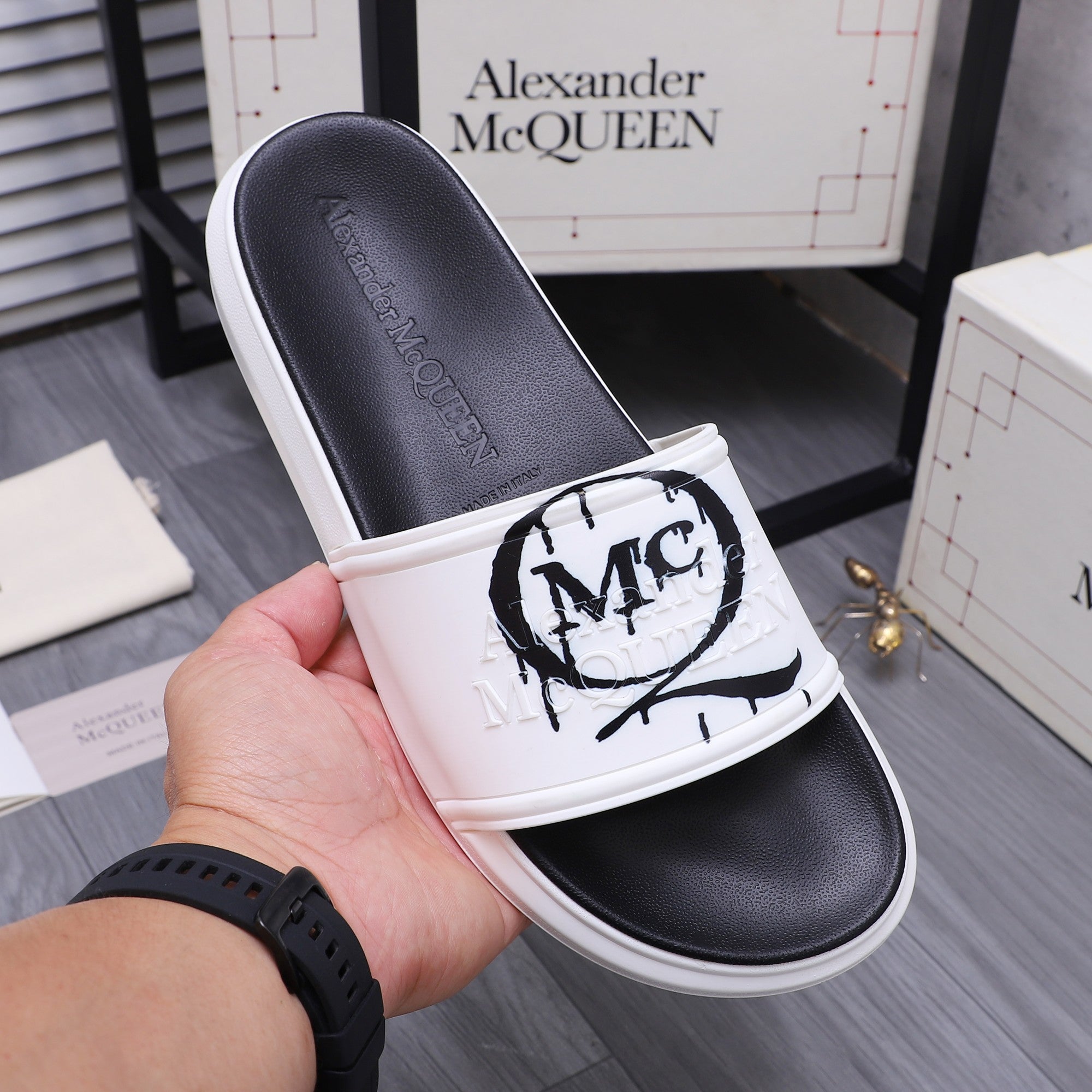 Alexander McQueen slide sandals, white strap with MC logo and black leather footbed