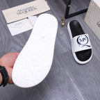Alexander McQueen slide sandal sole and matching pair, white outsole and black strap