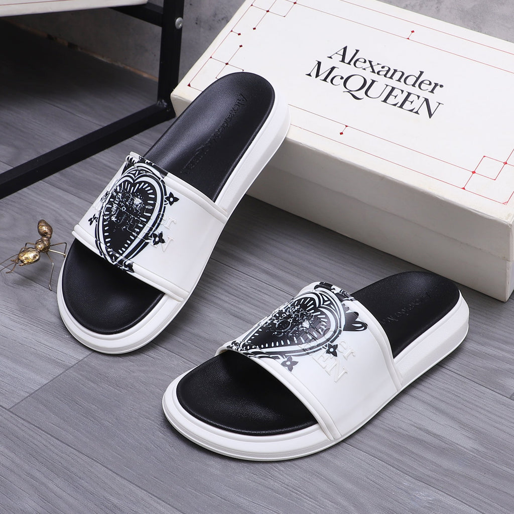 Alexander McQueen slide sandals, white slide with black crest detail and black footbed