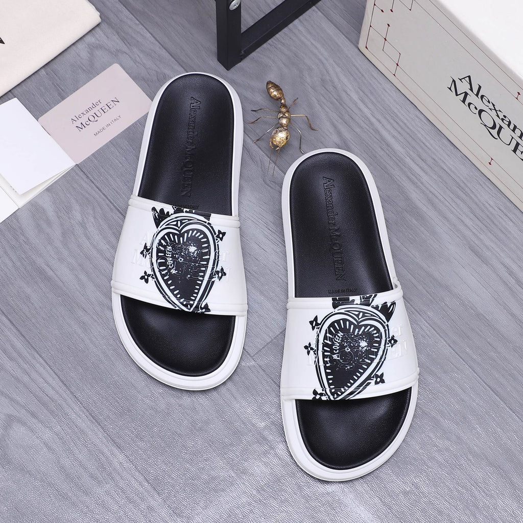 Alexander McQueen slide sandals, white strap with black crest emblem, black footbed