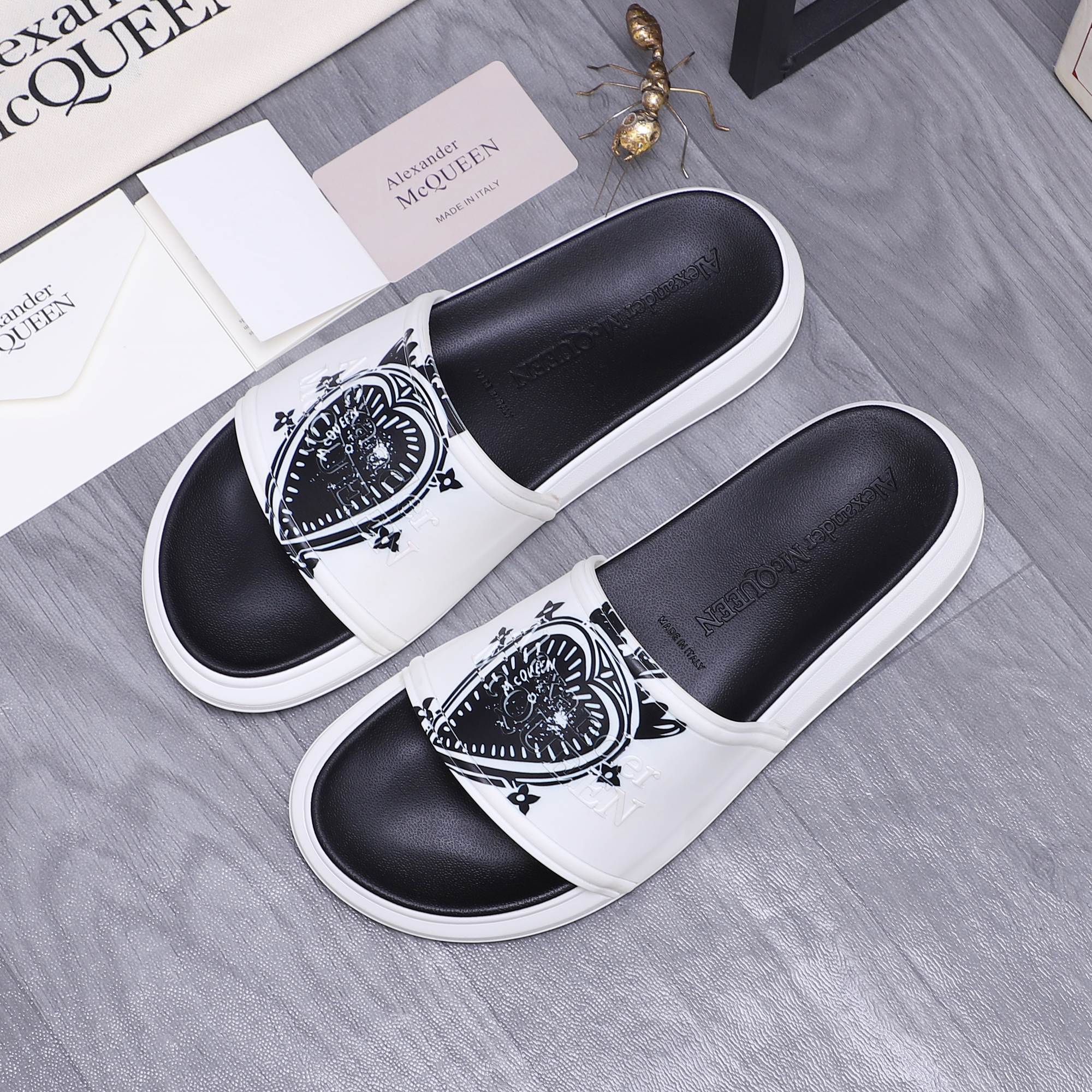 Alexander McQueen slide sandals, white strap with black graphic crest