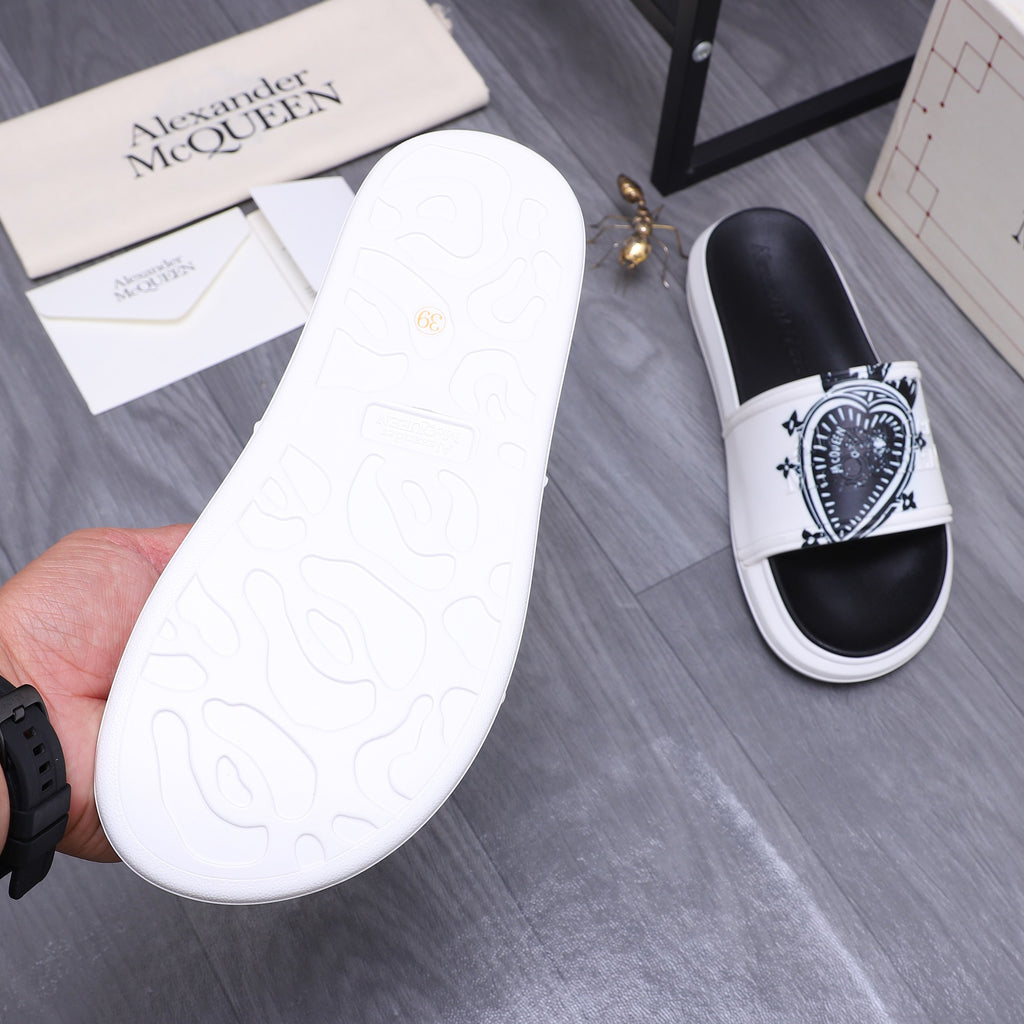 Alexander McQueen slide sandals, black footbed with white outsole tread and strap
