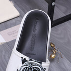 Alexander McQueen slide sandals, black interior footbed with embossed logo