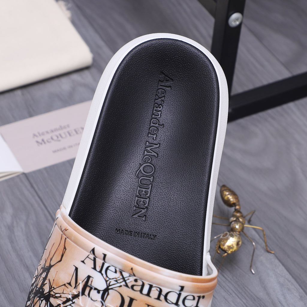 Alexander McQUEEN slide sandal footbed close-up with Alexander McQUEEN logo emboss