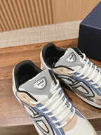 Dior unisex sneakers in white with blue trim, gray tongues, and black collars