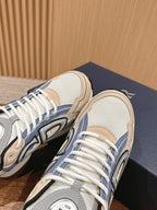 Dior low-top sneaker heel and side view, white mesh with blue stripe accents