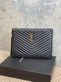 YSL small quilted clutch bag with chevron texture and gold logo at center front