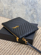 Quilted small bag with gold zipper and chain detail, dark blue chevron stitching
