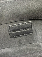 Inner leather label with SAINT LAURENT PARIS text on dark blue small bag