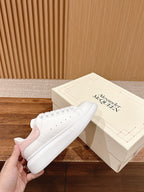 White leather low-top sneakers with lace-up eyelets