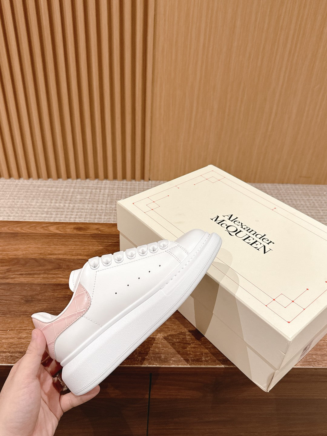 White leather low-top sneakers with lace-up eyelets