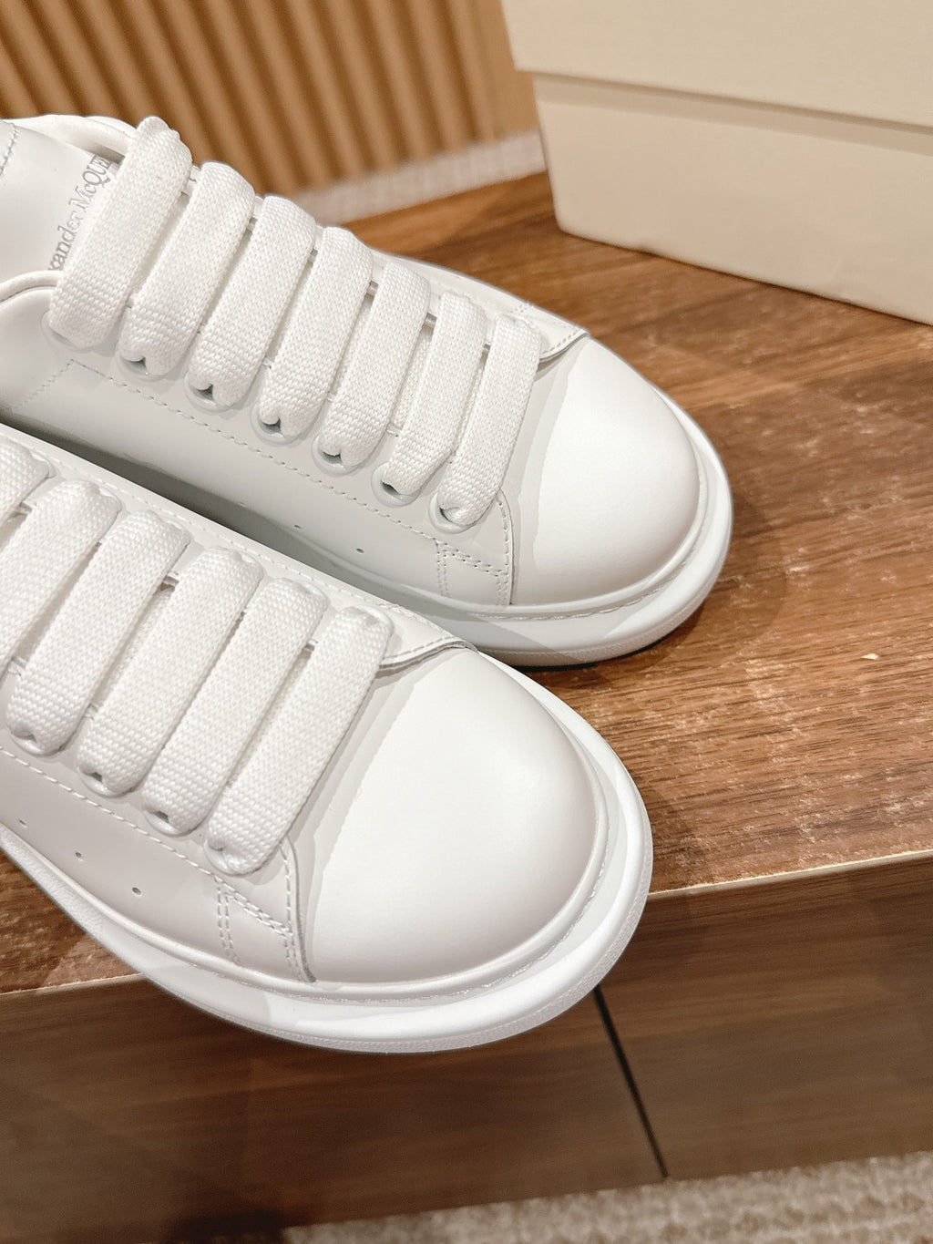 White leather low-top sneakers, viewed from side