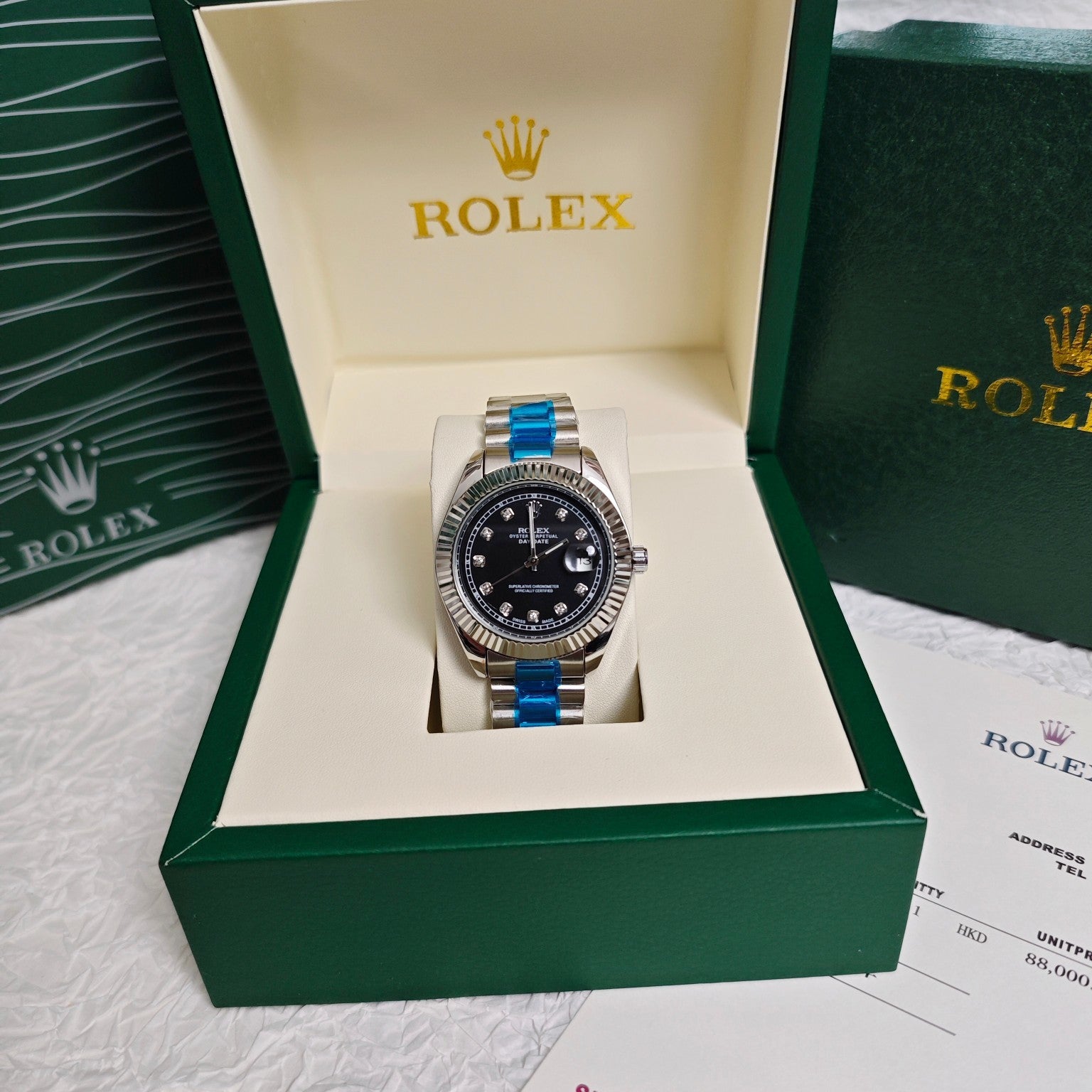 Rolex wristwatch in presentation box, black dial, steel bracelet and gold accents