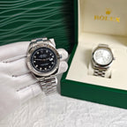 Rolex wristwatch in open box, black dial, steel bracelet and bezel