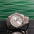 Rolex wristwatch with silver dial and metal bracelet, close-up front view