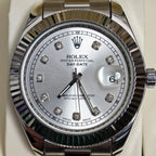 Rolex wristwatch close-up of silver dial with diamond markers and steel bezel