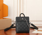 Louis Vuitton monogram mini bag with top handle and black shoulder strap