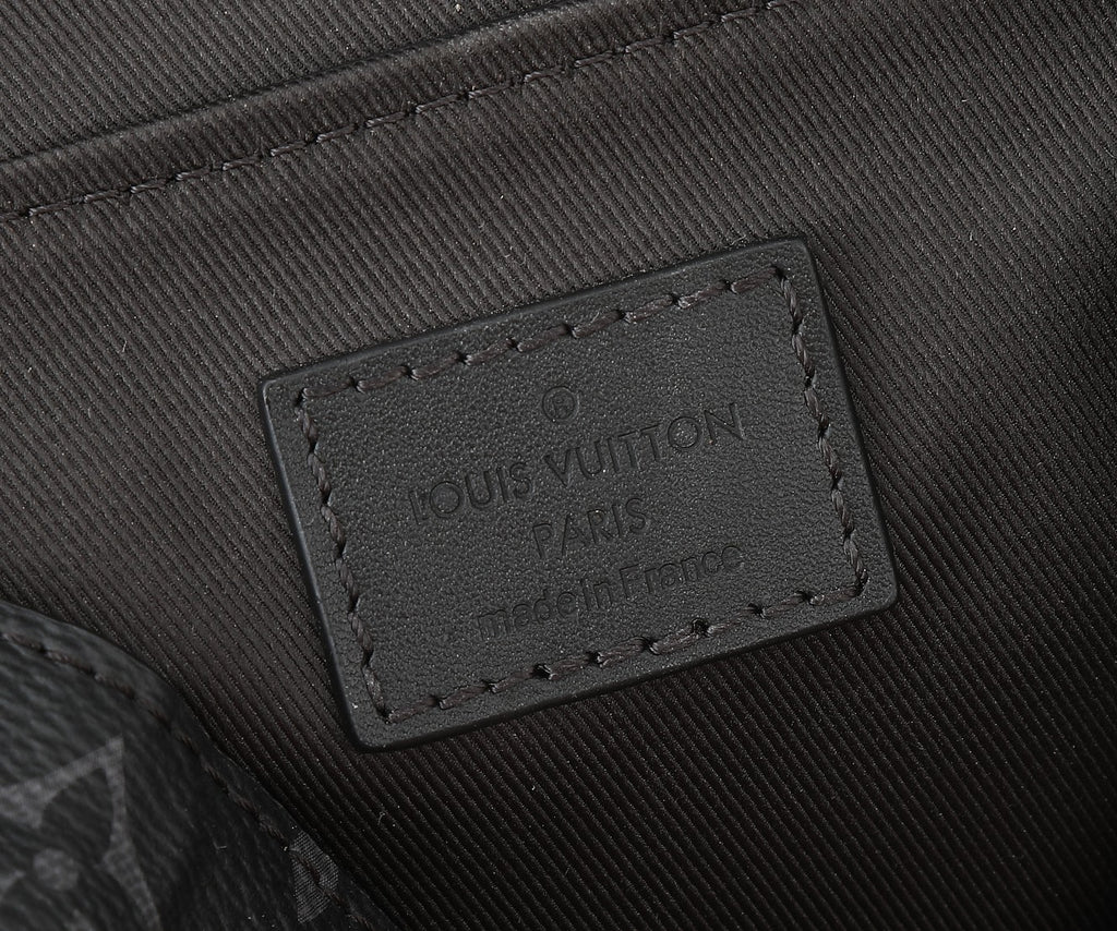 Louis Vuitton Apple label patch on black fabric bag lining