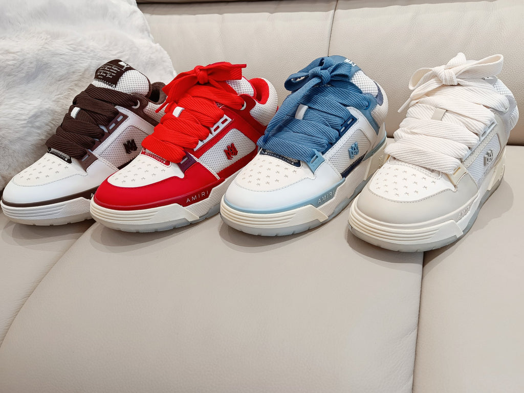 Four low-top sneakers in brown, red, blue, and white with lace-up fronts