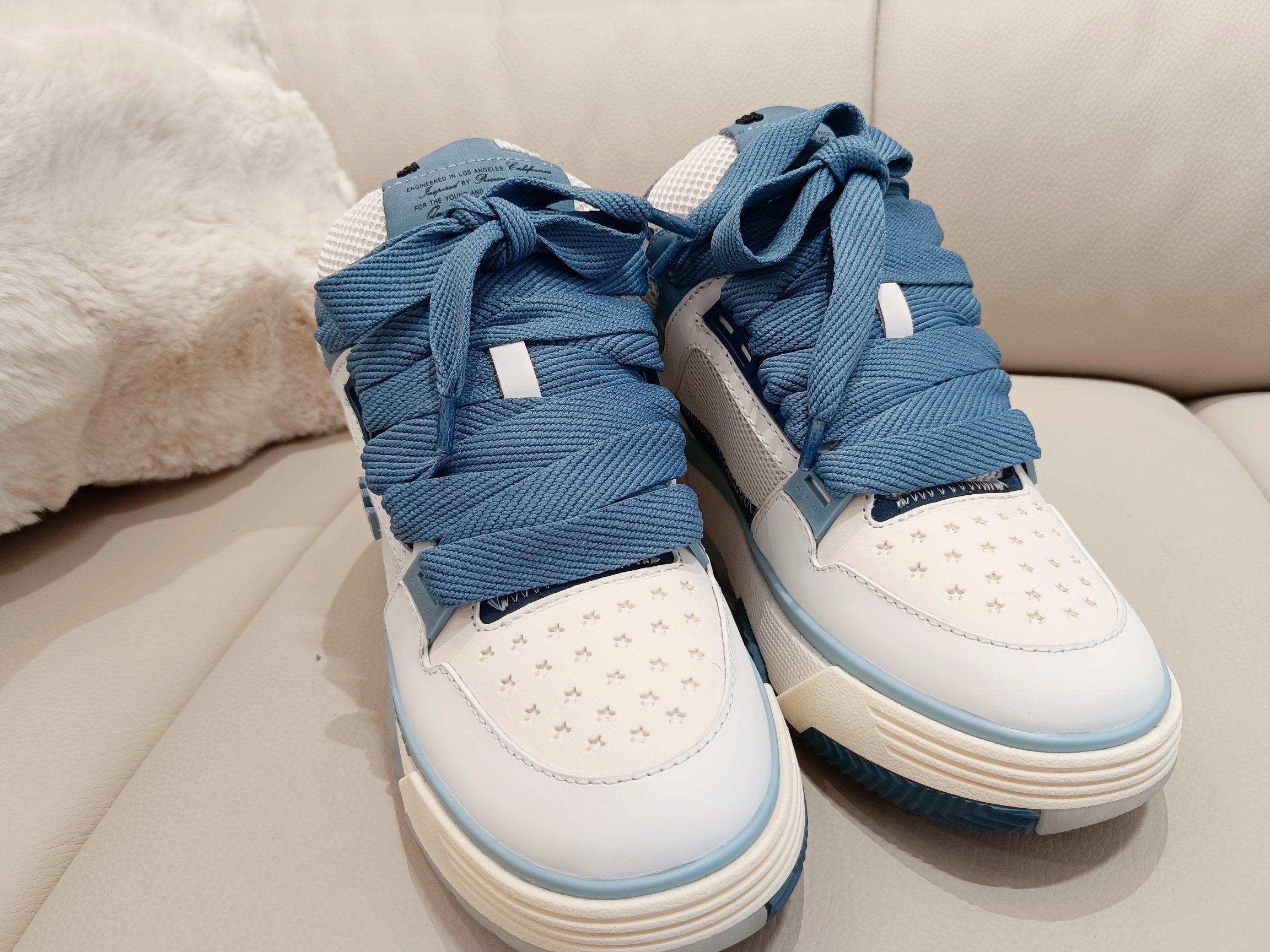 Amiri low-top sneakers, white and blue with crisscross laces and padded collar