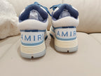 Amiri low-top sneakers, white and blue with "AMIRI" heel branding