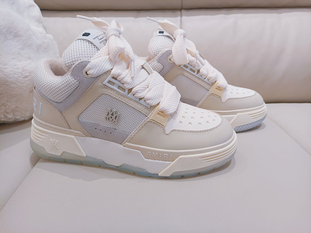 Light beige lace-up sneakers with side logo patch and chunky rubber sole