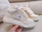 Beige and white lace-up sneaker with perforated side panel and chunky rubber sole
